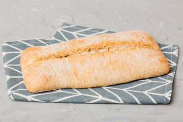 Assortment of freshly baked bread with napkin on rustic table top view. Healthy unleavened bread....