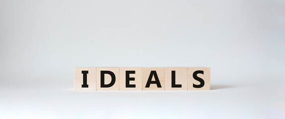 Ideals symbol. Wooden blocks with word Ideals. Beautiful white background. Business and Ideals concept. Copy space.