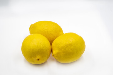 Three fresh lemons closeup