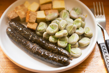 Broad beans with dill and butter with black pudding sausage 