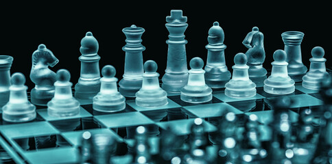 Glass chess on chess board. Photographed up close with the black background.