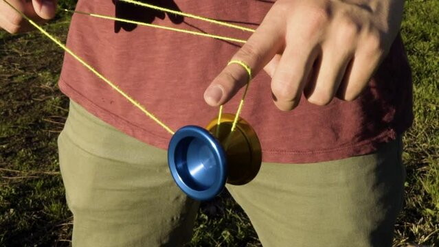 Close Up of a Spinning Yoyo Trick on a Blue and Orange Metal Yoyo