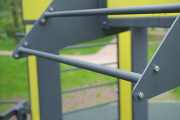 horizontal bar for pull-ups on the playground outdoors in the forest close-up