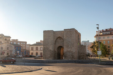 Ciudad Real, Spain. The Puerta de Toledo (Toledo Gate), a Gothic fortified city entrance formerly part of the walls. Horseshoe arch - obrazy, fototapety, plakaty