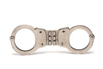 Closeup handcuffs closed bars police white background