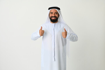 Happy Arab Emirati man thumbs up isolated on white background wearing traditional. Arabian Muslim man excited for new business