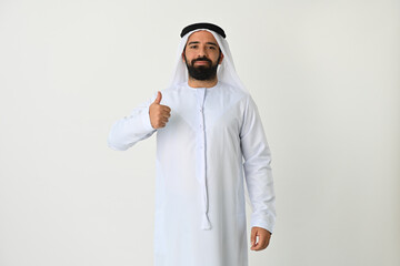 Happy Arab Emirati man thumbs up isolated on white background wearing traditional. Arabian Muslim man excited for new business