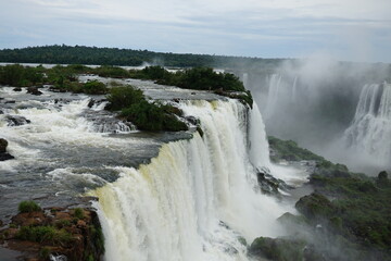 The photo shows a stunning view from the top of the Iguazu Falls — a complex of 275 waterfalls on the Iguazu River, located on the border of Brazil and Argentina.