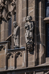 Obraz premium Architectural details of medieval Cologne Town Hall (Rathaus Koln) - XV century Gothic style tower. Cologne, North Rhine Westphalia, Germany.