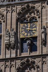 Architectural details of medieval Cologne Town Hall (Rathaus Koln) - XV century Gothic style tower. Cologne, North Rhine Westphalia, Germany.