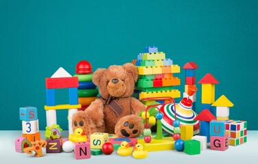 Adorable toddlers many toys at home. A mess in the children's room, a lot of toys in the children's...