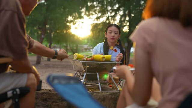 Happy family little girl preparing barbecue together, Cooking grilled bbq dinner outside beach, enjoy summer on the beach enjoy on weekend people lifestyle.