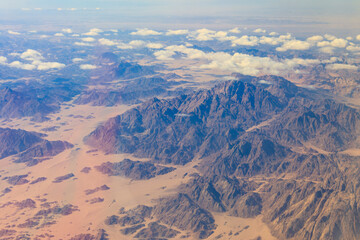 Fototapeta na wymiar View of the Sinai mountains and desert in Egypt. View from a plane