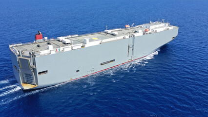 Aerial drone photo of Large RoRo (Roll on-off) car cargo ship cruising the Mediterranean deep blue sea
