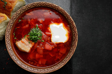 Red borscht with buns with garlic and sour cream