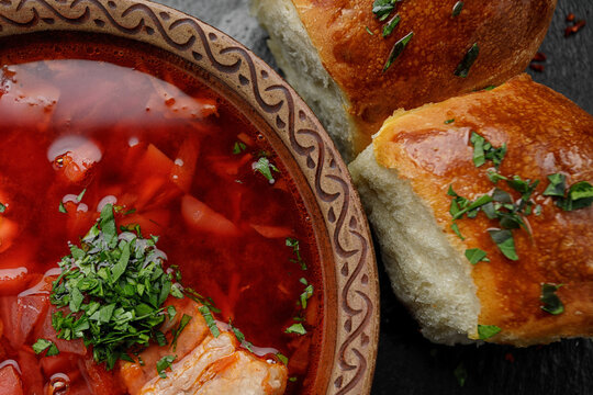 Red borscht with buns with garlic and sour cream
