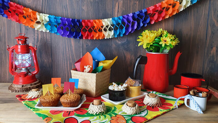 Decorated, colorful and cheerful table with foods sweet and savory, typical of the Brazilian June festival.