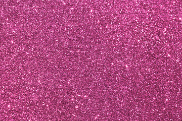 Magenta pink glitter texture background. Photo can be used for New Year, Christmas and all celebrations concepts.