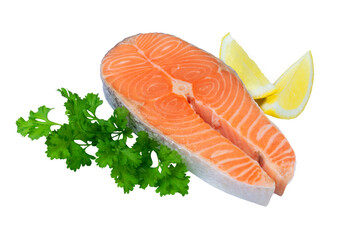 Raw salmon steak isolated on white with parsley and lemon