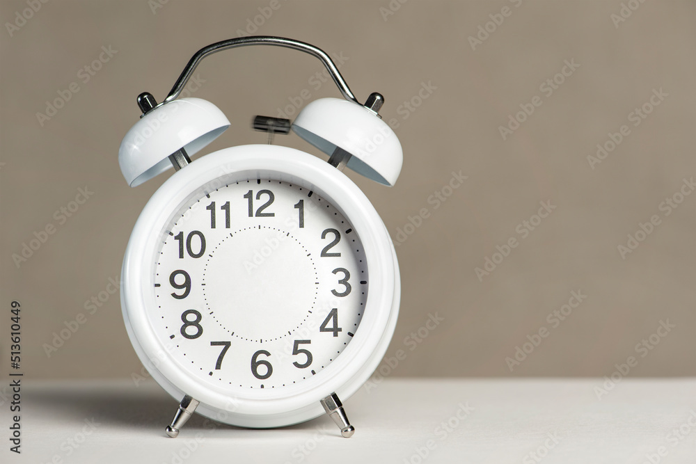 Poster alarm clock without arrows. white classic alarm clock on a white background without arrows, space to