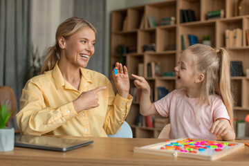 Speaking classes for kids. Adorable child girl showing and pronouncing sound R with her friendly...