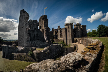 The ruins of Raglan castle shot with one of the original walls leading the focus to the medieval...
