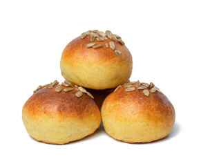 A bunch of round baked buns with sunflower seeds