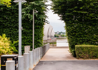 Walkway in the park. Thames Barrier in the background, Silvertown, Newham, London,  England, June 19, 2022