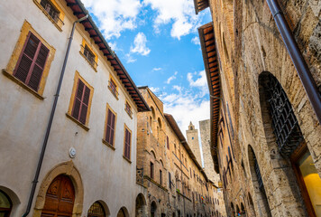 The historic walls and towers from inside the medieval Tuscan hill town of San Gimignano, Italy.
