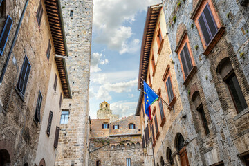 Obraz premium The historic walls and towers from inside the medieval Tuscan hill town of San Gimignano, Italy.