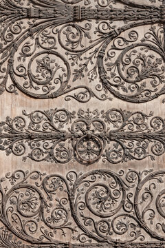Detail with metal decorations on a wooden door