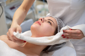 Fototapeta na wymiar Close up of young woman getting spa massage treatment at beauty spa salon.