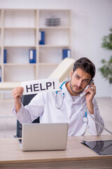 Young male doctor working in the clinic