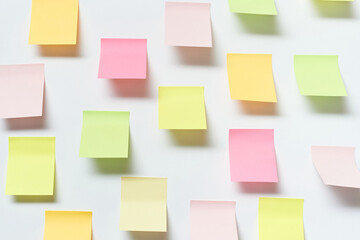 Sticky notes over white background.