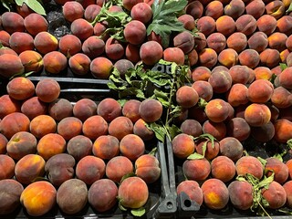 peaches lie on the counter in the market