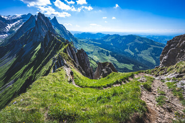 Hiker is walking along the a beautiful altitude path