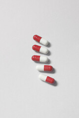 Pharmaceutical pills over white background.