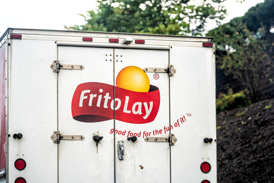 Sylva, USA - October 6, 2021: Truck back closeup on street road in small town in North Carolina countryside with advertisement for Frito-Lay company selling chips subsidiary of PepsiCo