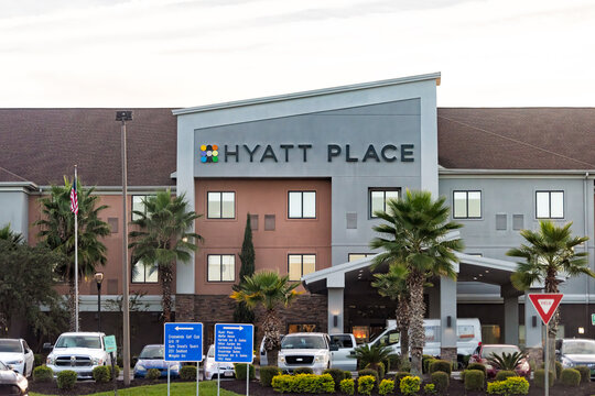 Pooler, USA - October 18, 2021: Hyatt Place hotel building exterior modern architecture in Georgia evening near interstate highway i-85 with cars in parking lot and sign