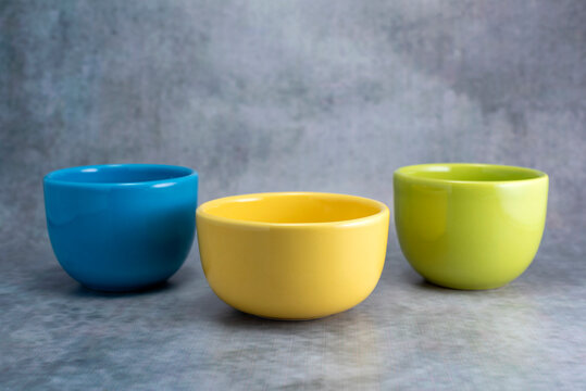 ceramic cups and bowls of various colors and modern deco designs for different infusions and foods