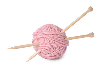 Soft pink woolen yarn and knitting needles on white background