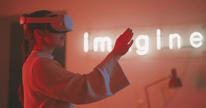 Young woman experiencing virtual reality with goggles then taking them off