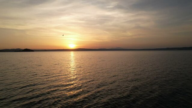 Sunset on Lago di Bolsena - aerial back travelling