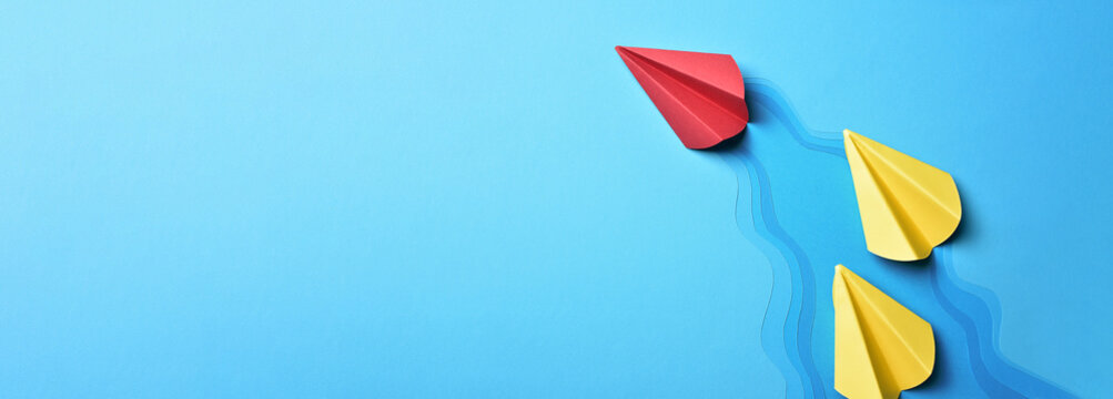 Success leadership strategy concept, rocket paper fly over color blue river,inspiration Individual red paper