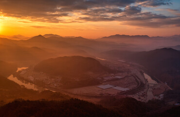 Fototapeta na wymiar Scenic view of mountains against sky during sunrise