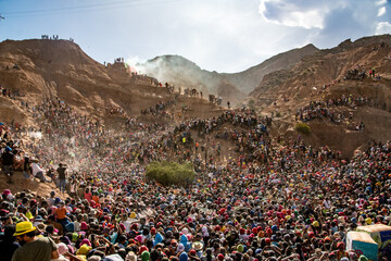 group of people walking in the mountains