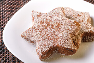 delicious chocolate flavor cookie sprinkled with sugar late night snack placed on a white plate homemade