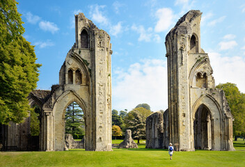 Glastonbury Abbey, Somerset, England. View east from the nave through the ruined arches to the choir - obrazy, fototapety, plakaty