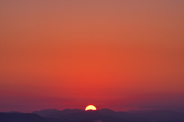 Scenic view of mountains against sky during sunrise