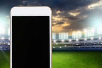 Smartphone with a blank screen on a football stadium
